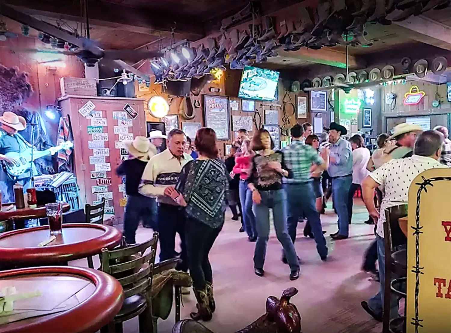 Country western dancing to live music at the Buffalo Chip Saloon in old town Cave Creek