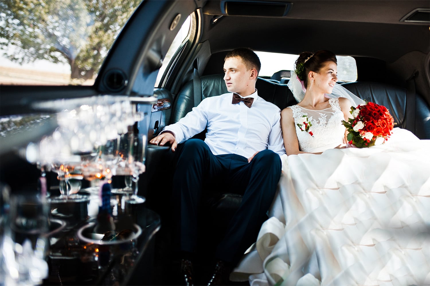 A bride and groom enjoying their limo rental.