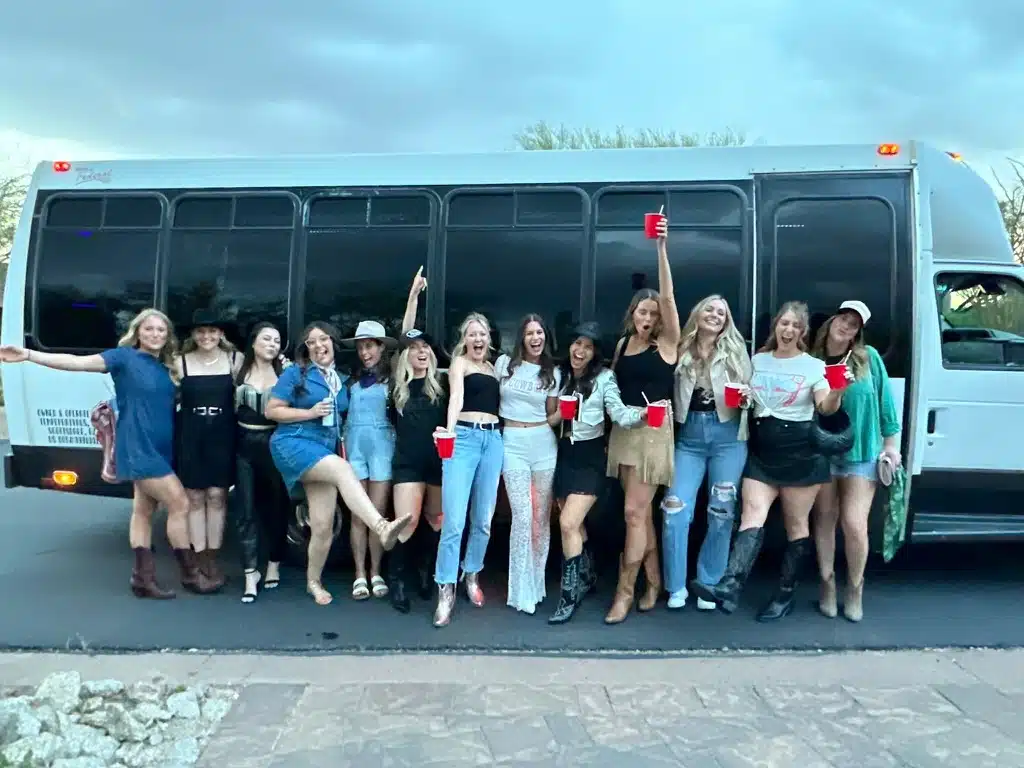 woo girls in front of party bus